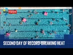 Latest heatwave coverage - with red warning still in place