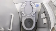Why airplane toilets are tiny engineering marvels