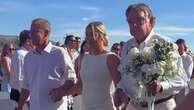 Bride has 15 'father figures' walk her down aisle