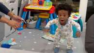 Toddler shocks himself by taking 1st steps