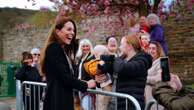 Baby plays with Princess Kate's handbag