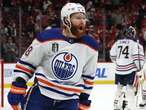 Duck! Paul Coffey takes it on the chin in Oilers practice