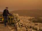 Martian skies over Athens? Greece’s capital turns an orange hue with dust clouds from North Africa