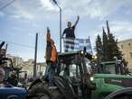 ’Without us, you don’t eat’: Greek farmers ride some 200 tractors to Athens to demand financial help