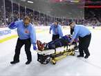 NHL referee taken off ice on stretcher after violent collision