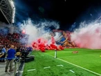 Israeli soccer game abandoned after rioting rival fans throw flares and smoke grenades