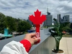 Maple leaf-shaped clapper an extra source of pride for Canadian World Cup fans