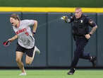 Reds fan does backflip in front of cop on field, gets zapped for his efforts