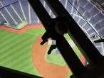 Viral video shows daredevils hanging from Rogers Centre rafters above field