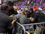 Police use Taser to subdue man who stormed media area of Trump rally