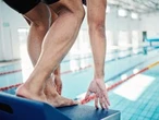 'NOT A THREAT': Transgender woman swims topless in men’s race to protest ban