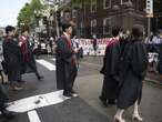 Group of graduates walk out of Harvard commencement chanting ’Free Palestine’