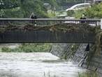 Slow tropical storm dumps heavy rain around Tokyo after causing floods in southern Japan