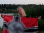 Киянка розмістила у мережі фото з нацистським прапором. ЗМІ пише, що це співробітниця Святошинського суду