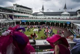 Anna Nicole Smith's daughter Dannielynn resembles mom in vibrant red dress and floral hat at Kentucky Derby