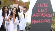 ‘Care cuts kill': Doctors carrying coffins rally against health care cuts