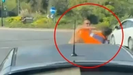 Moment 'road rage' motorist swings PUNCHES at driver in row at roundabout