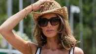 Amy Childs looks slimmer than ever as she strips off to plunging swimsuit