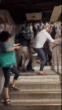 Moment brawl breaks out in packed Tube station with TODDLER stuck in chaos