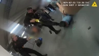 Cop who kicked man in head during airport brawl says he acted 'professionally'