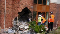 Two charged with kidnap and robbery after BMW crashes into care home