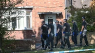Woman rushed to hospital after being shot at home as cops hunt for gunman