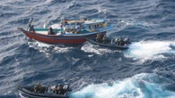Marines pose with £30m worth of drugs after storming smuggler’s dhow