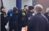 Moment knifewoman is arrested after station rampage that left 18 injured