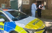 Woman charged over murder of film director, 69, stabbed to death at home
