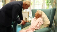 Sweet moment Charles holds hand of 116-year old Brit who's world’s oldest person