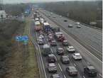 Major motorway near airport SHUTS due to smash between three cars and lorry