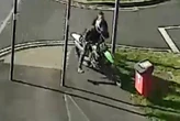 Moment biker yob drags hero cop down road after fleeing arrest