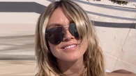 Heidi Klum nearly busts out of pink bikini as she sunbathes on Cannes trip