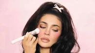 Kylie Jenner spills out of tiny pink bra as she debuts new product