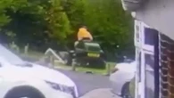 Moment 'imbecile' council worker mows down kids' football goalposts