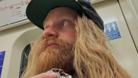 Millionaire pop star goes unnoticed by London commuters as he rides the tube