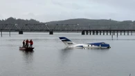 Plane skids off airport runway and splashes down on river in horror landing