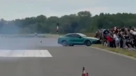 Horror moment car crashes into crowd of spectators at drag racing event