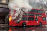 Double-decker bus erupts into flames in busy street outside hospital