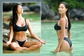 Nicole Scherzinger stuns in black bikini while doing yoga on the beach
