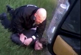 Moment driver punched in FACE & wrestled to floor by cop as he wins £100k payout