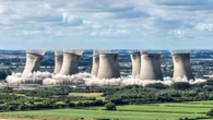 Moment 375ft-tall cooling towers crash to ground in simultaneous demolition