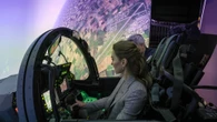Kate has a go in RAF Typhoon flight sim on airbase visit to meet troops
