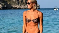 Jenni Falconer, 49, shows off her incredible figure in leopard print bikini