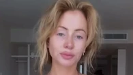 Olivia Attwood poses in her bra as she faces the 'dog house' with husband