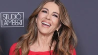 Liz Hurley stuns in red dress as Billy Ray supports her at Inheritance premiere