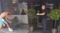 Moment gang 'of 30 teens' hurl chairs at waiters in UK seaside town rampage