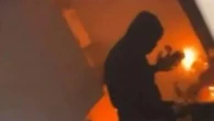 Moment vile riot yob shouts 'f*** foreigners' while setting home on fire