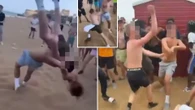 Moment topless teens erupt in fistfight on beach in day of seaside yob chaos