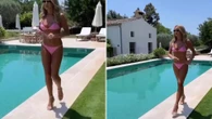 Amanda Holden, 54, looks amazing as she strips down to tiny pink bikini
